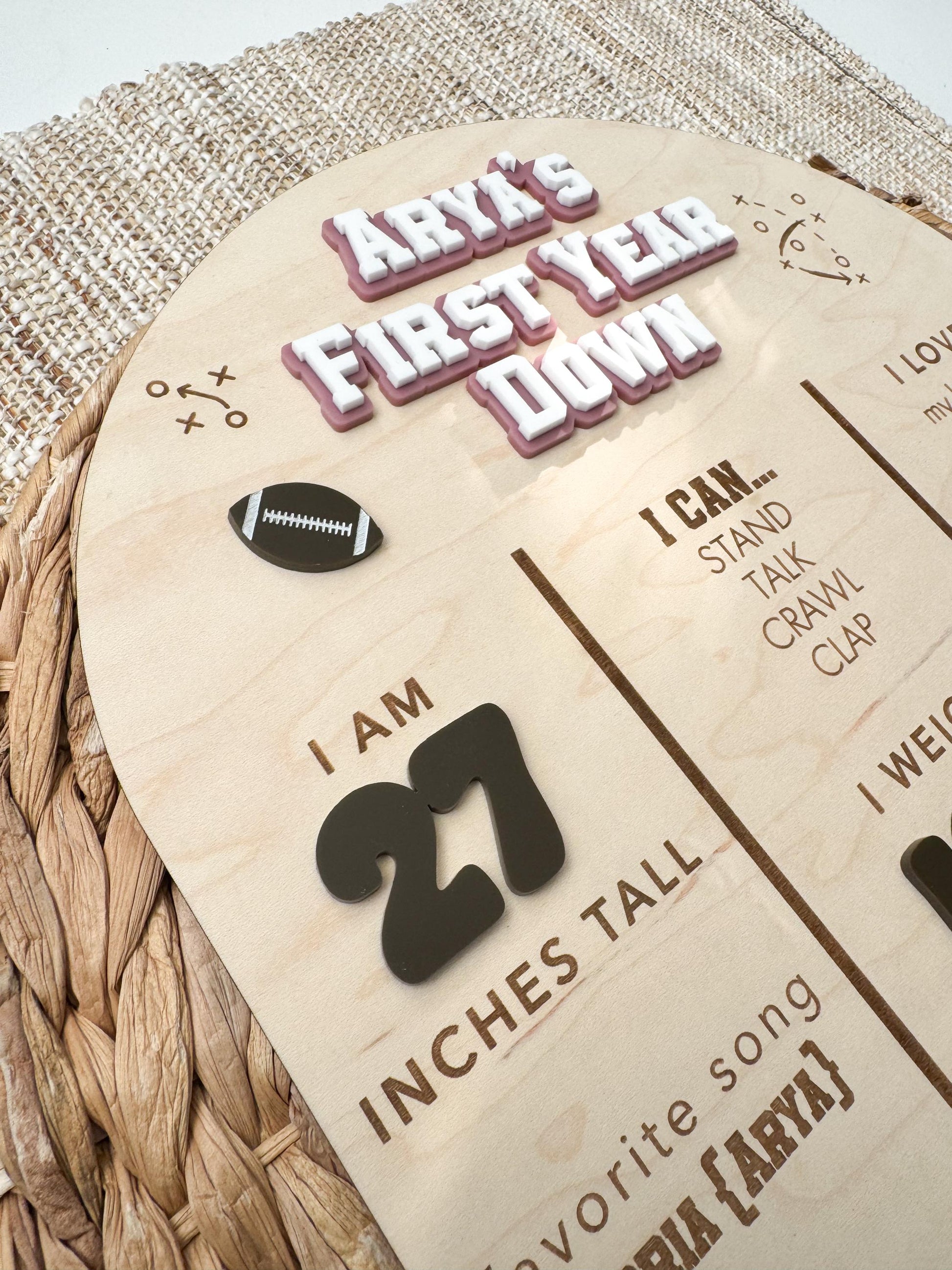 Personalized football first birthday stat board showing baby name, height, weight, and milestones