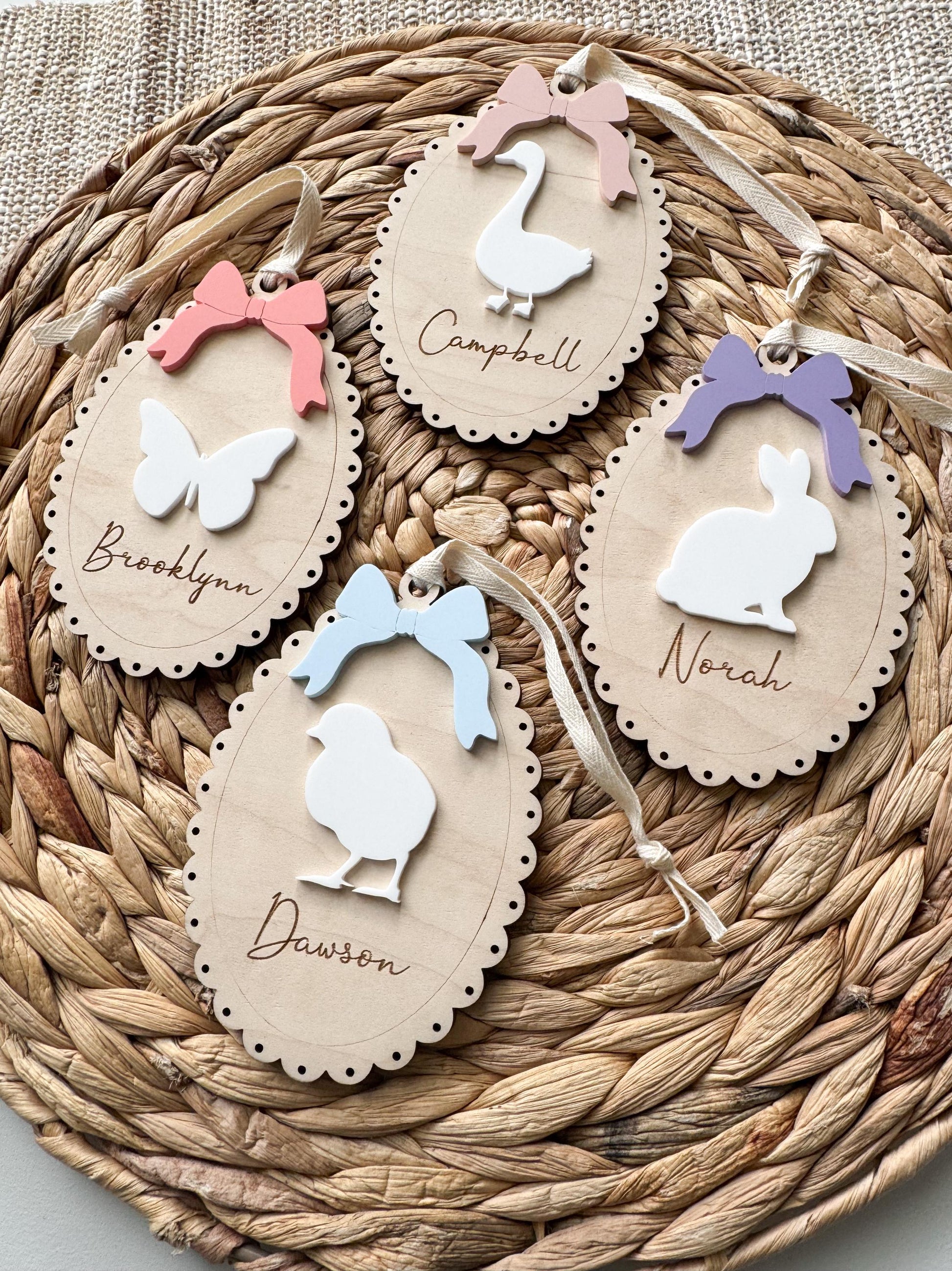 Variety of personalized Easter basket name tags showing egg, bunny, and chick designs