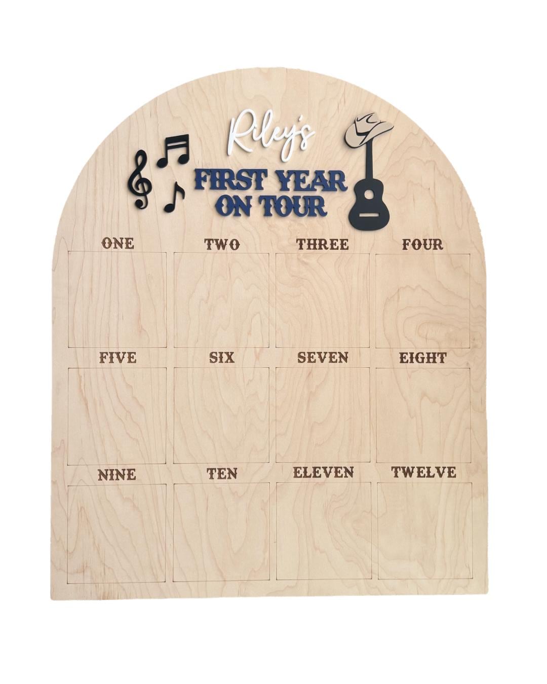 Close-up of First Year On Tour music photo board with personalized name and musical design