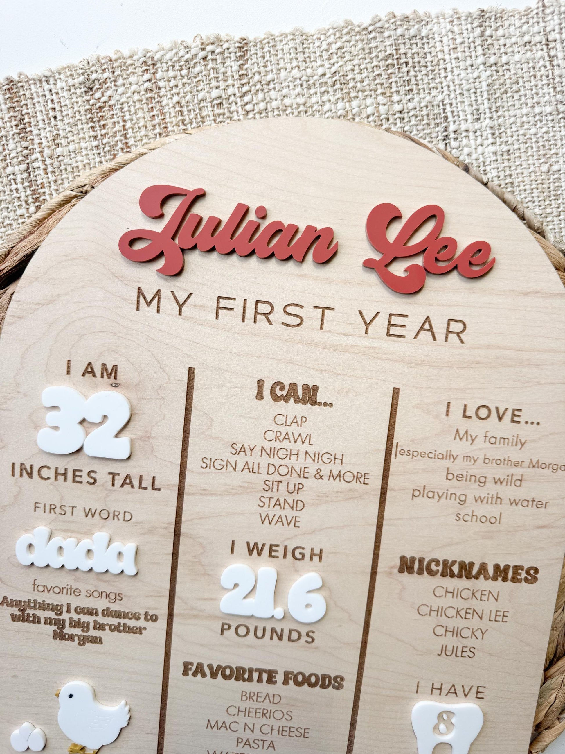 Custom baby milestone board with layered acrylic name on maple wood birthday stats sign