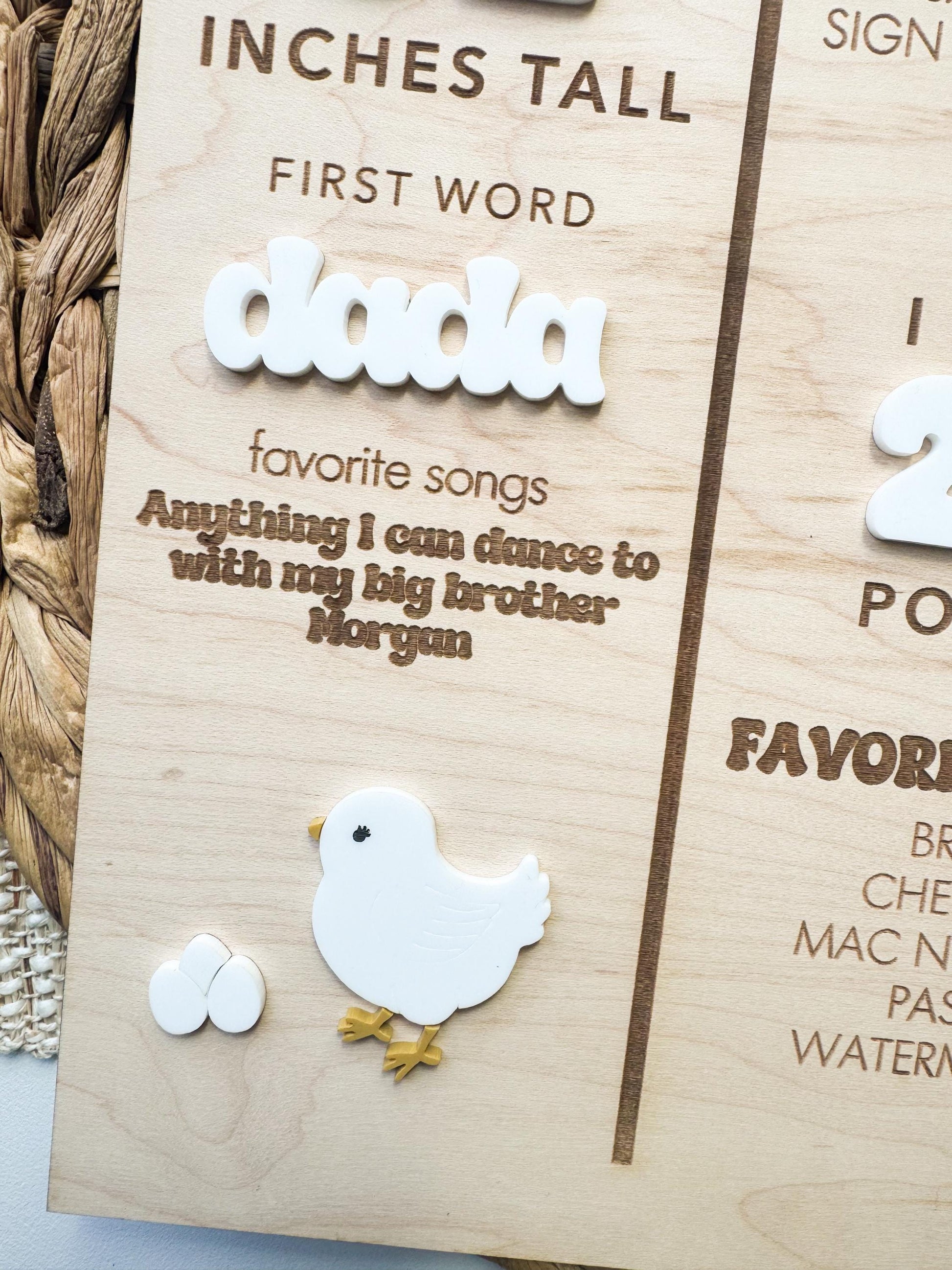 Maple wood milestone board with engraved baby stats and layered acrylic decorative accents