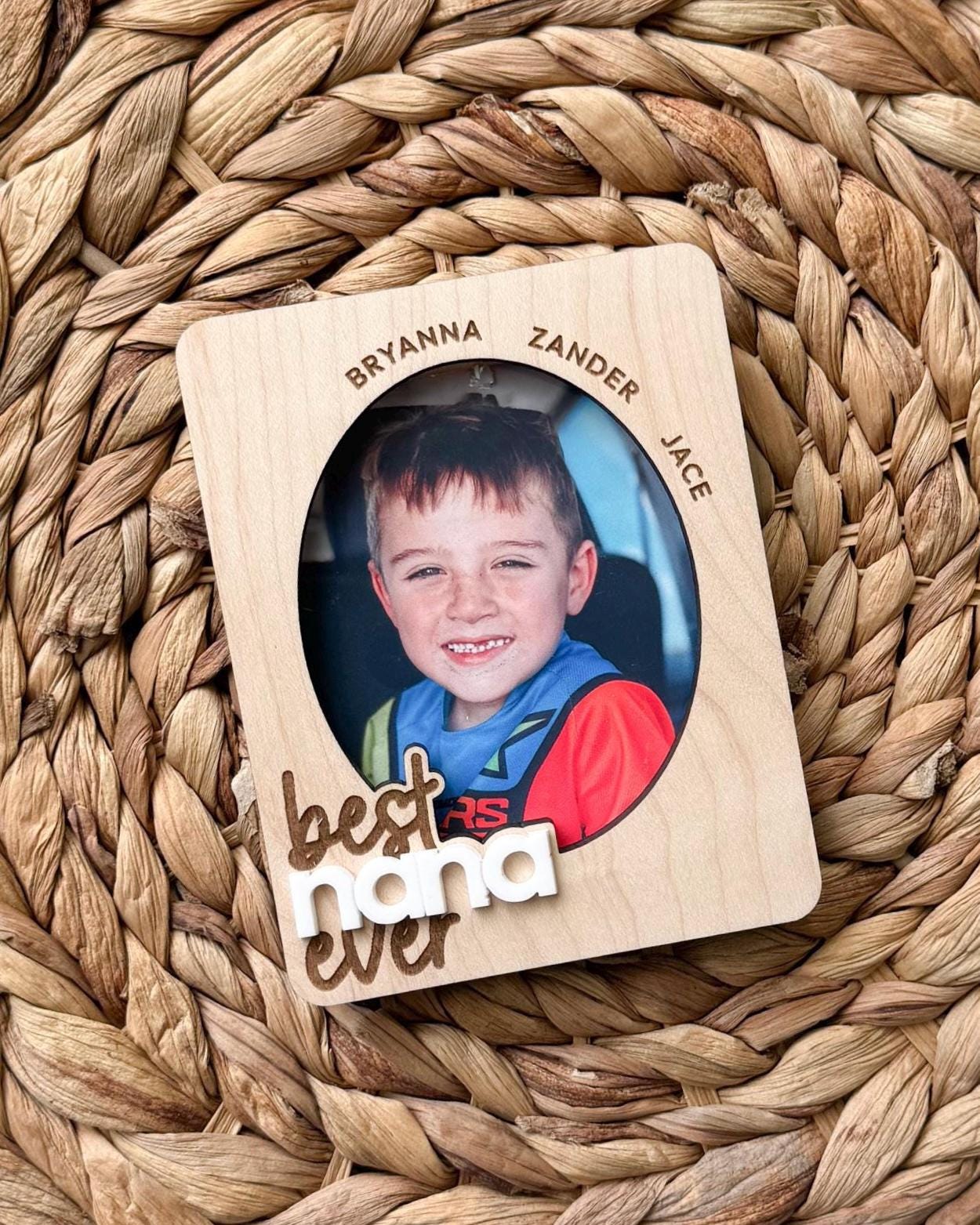 Wooden photo frame visor clip with child picture and personalized names around frame