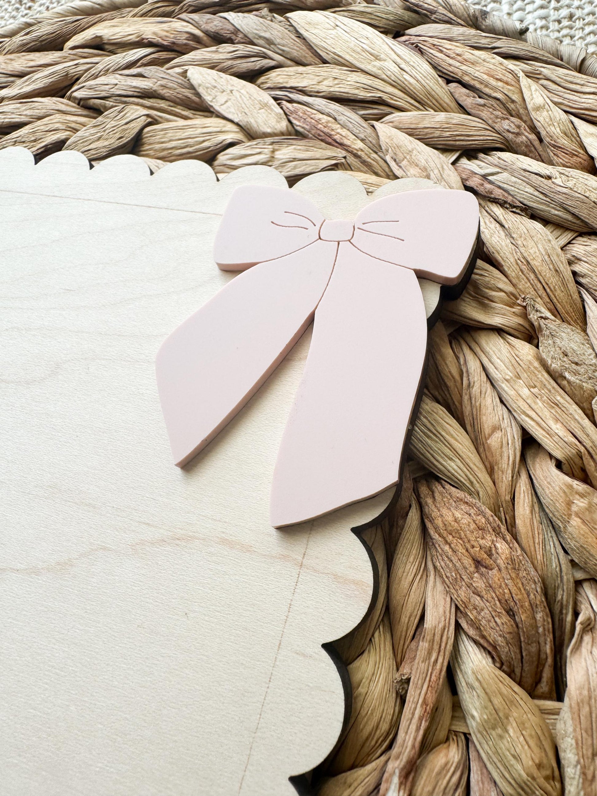 Close-up of handprint bow keepsake sign with personalized name and handprint detail