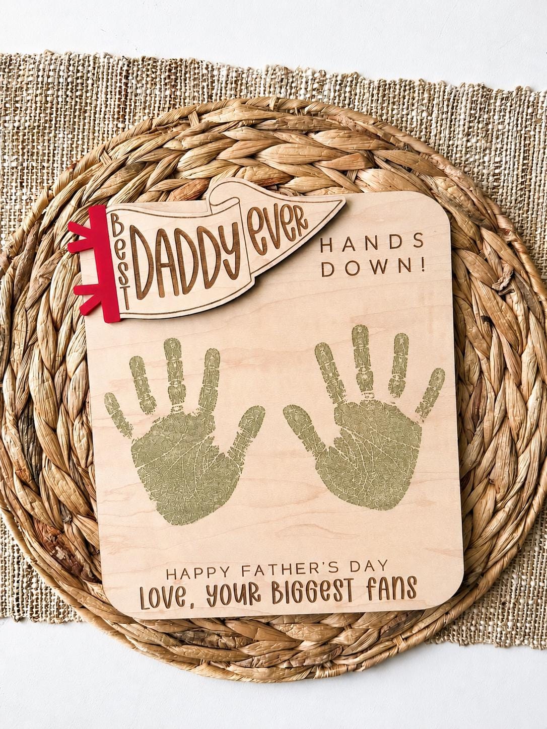Maple wood daddy handprint plaque displayed on woven neutral background