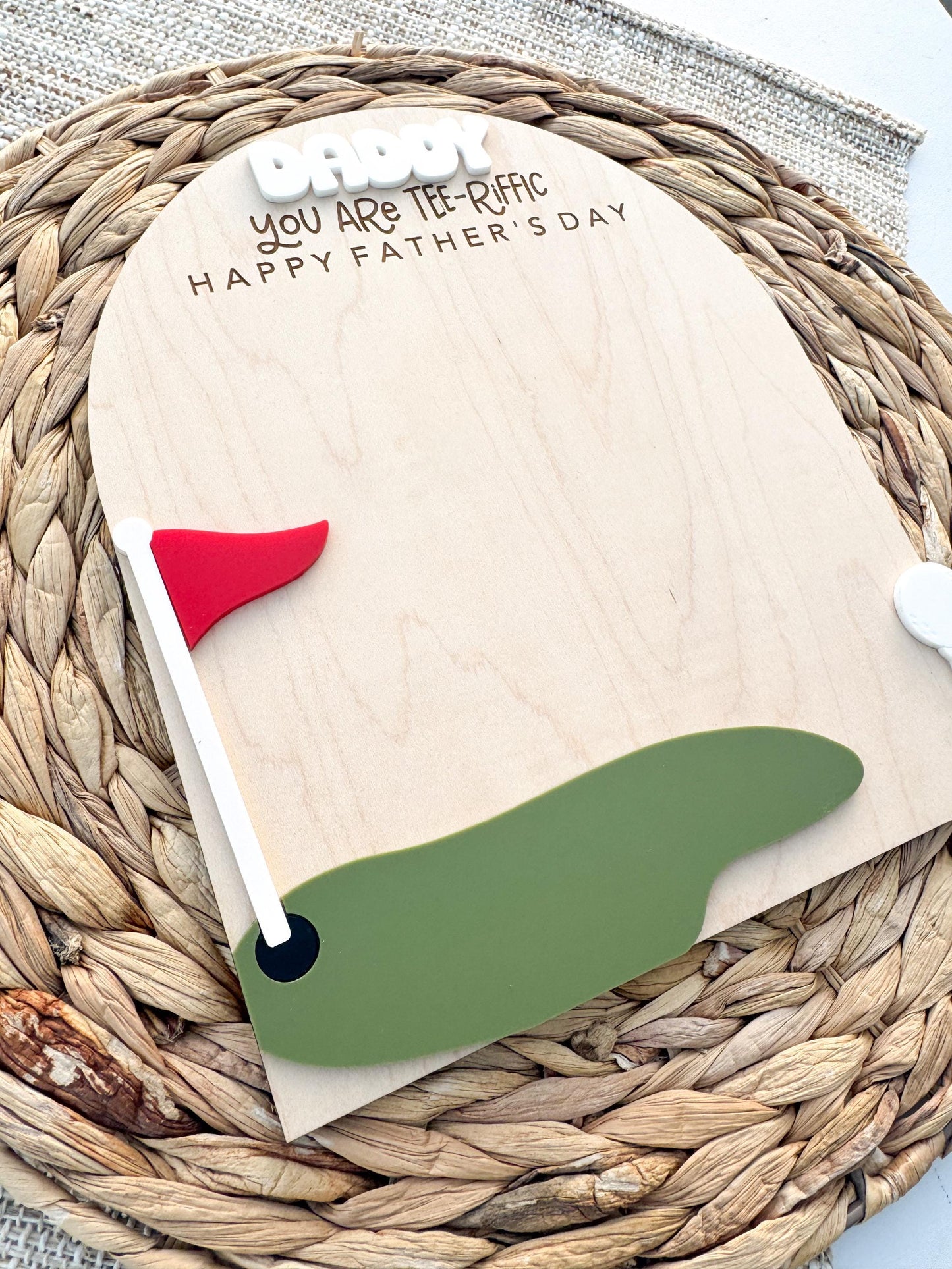 Maple wood golf handprint keepsake displayed on woven neutral background