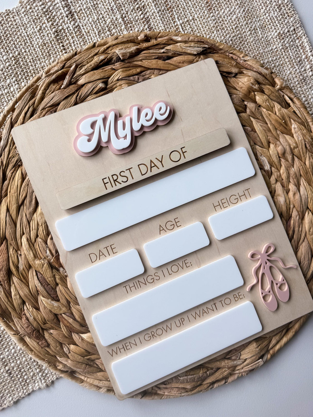 Angled view of personalized ballet back to school board with layered acrylic name and ballet slipper detail.