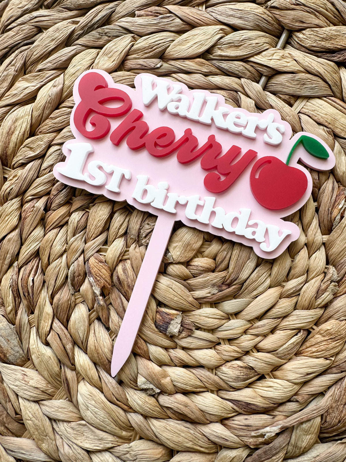 Front view of custom One Sweet Cherry birthday topper with personalized name and cherry accent.