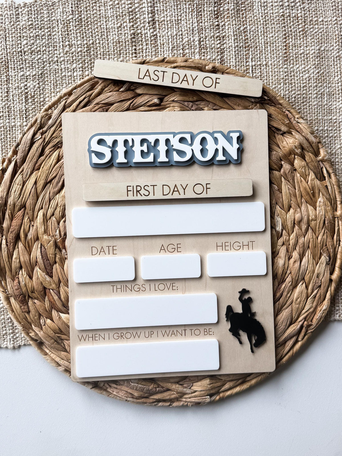 Personalized school milestone board with interchangeable First Day and Last Day plaques, layered acrylic name, and dry erase writing spaces.