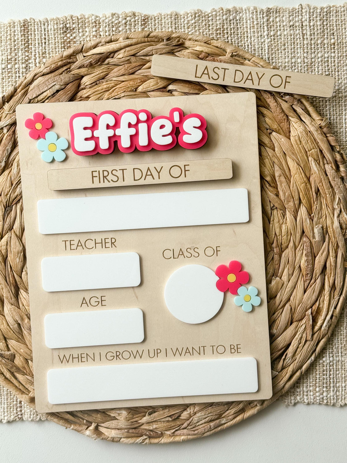 Personalized floral first day of school sign with pink layered name and reusable dry erase sections.