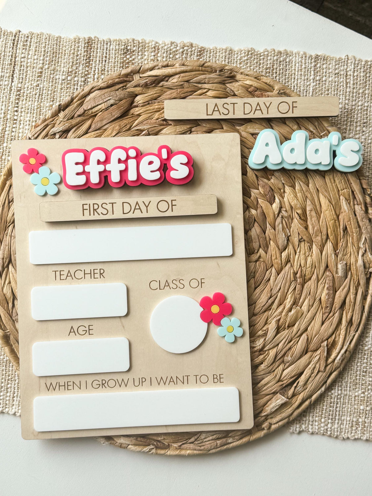 Daisy back to school sign shown with two interchangeable personalized names for siblings sharing one school board.