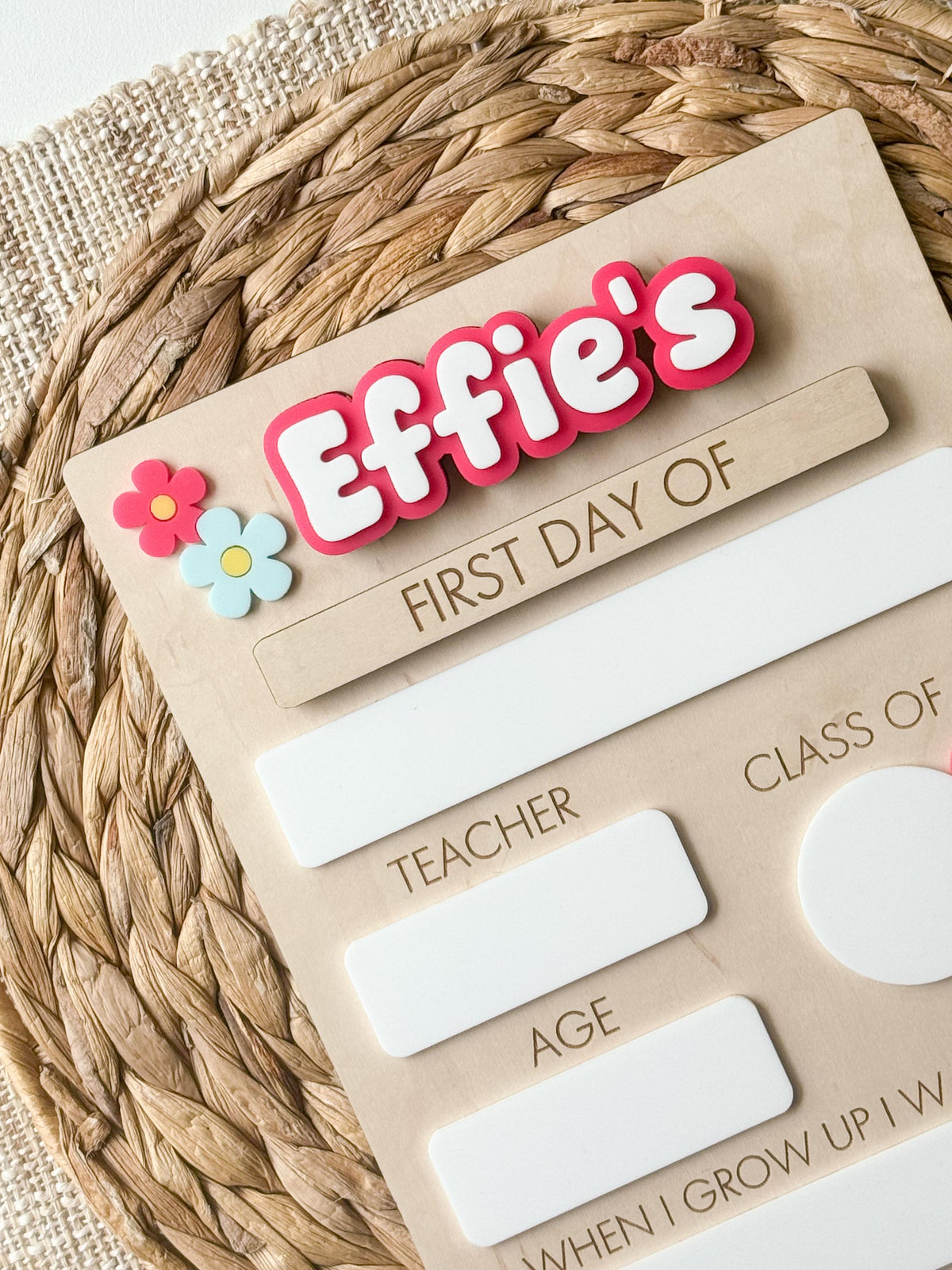 Personalized floral first day of school board with pink name, layered daisies and reusable dry erase fields.