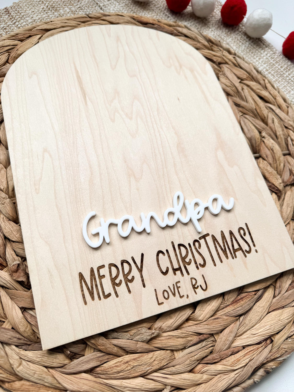 Angled view of Grandpa Merry Christmas sign showing the laser engraved detail