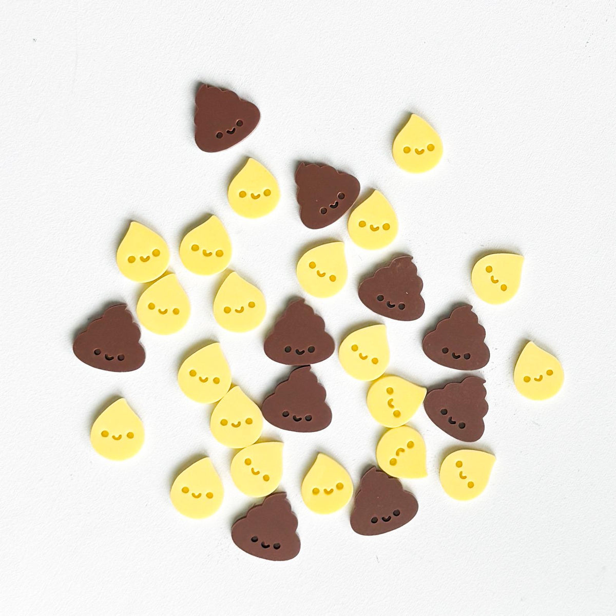 Set of yellow pee drop and brown poop acrylic potty tokens with smiling faces for a toddler reward jar
