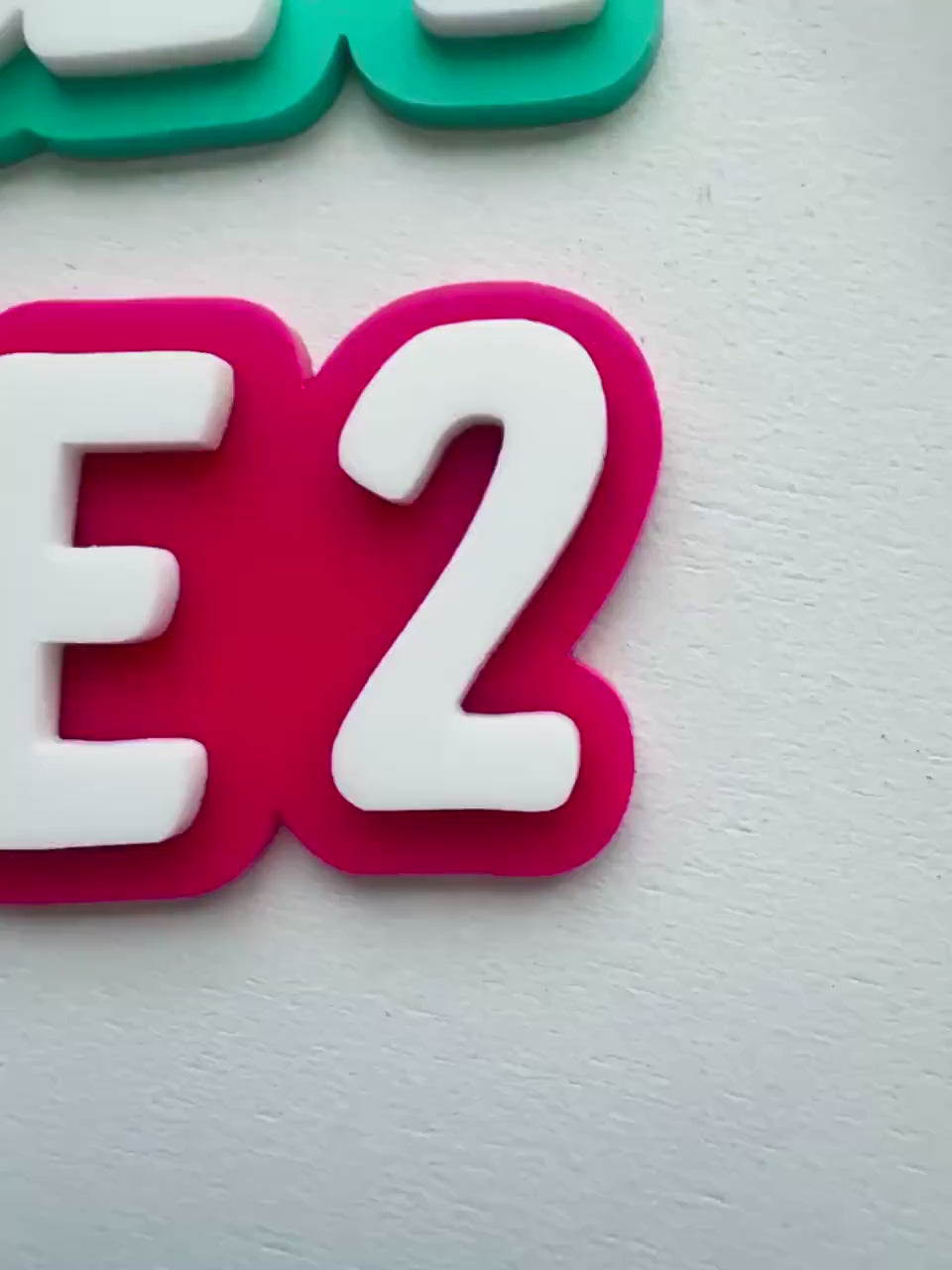 Video of custom layered acrylic classroom magnets for whiteboards