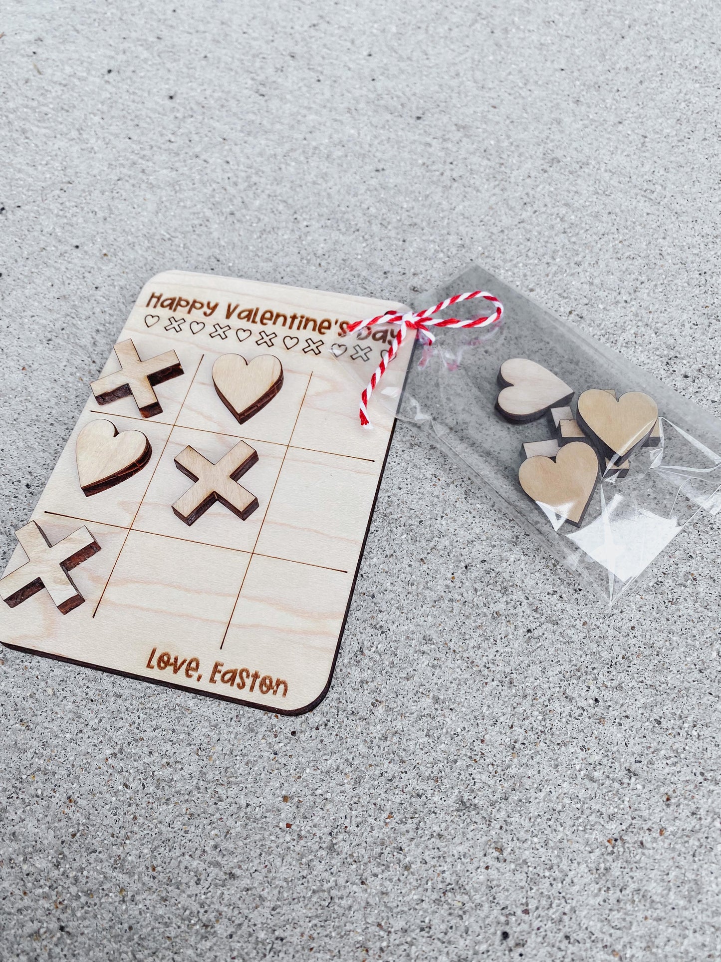 Valentine tic tac toe game card showing playing pieces and game board