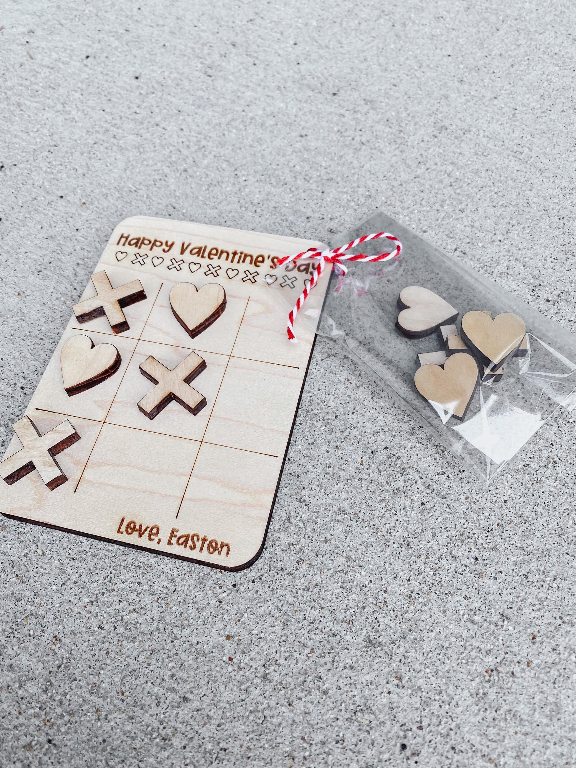 Valentine tic tac toe game card showing playing pieces and game board