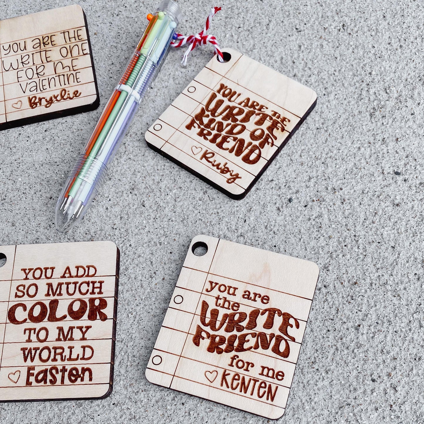 Close-up of multicolor click pen Valentine card with attached pen