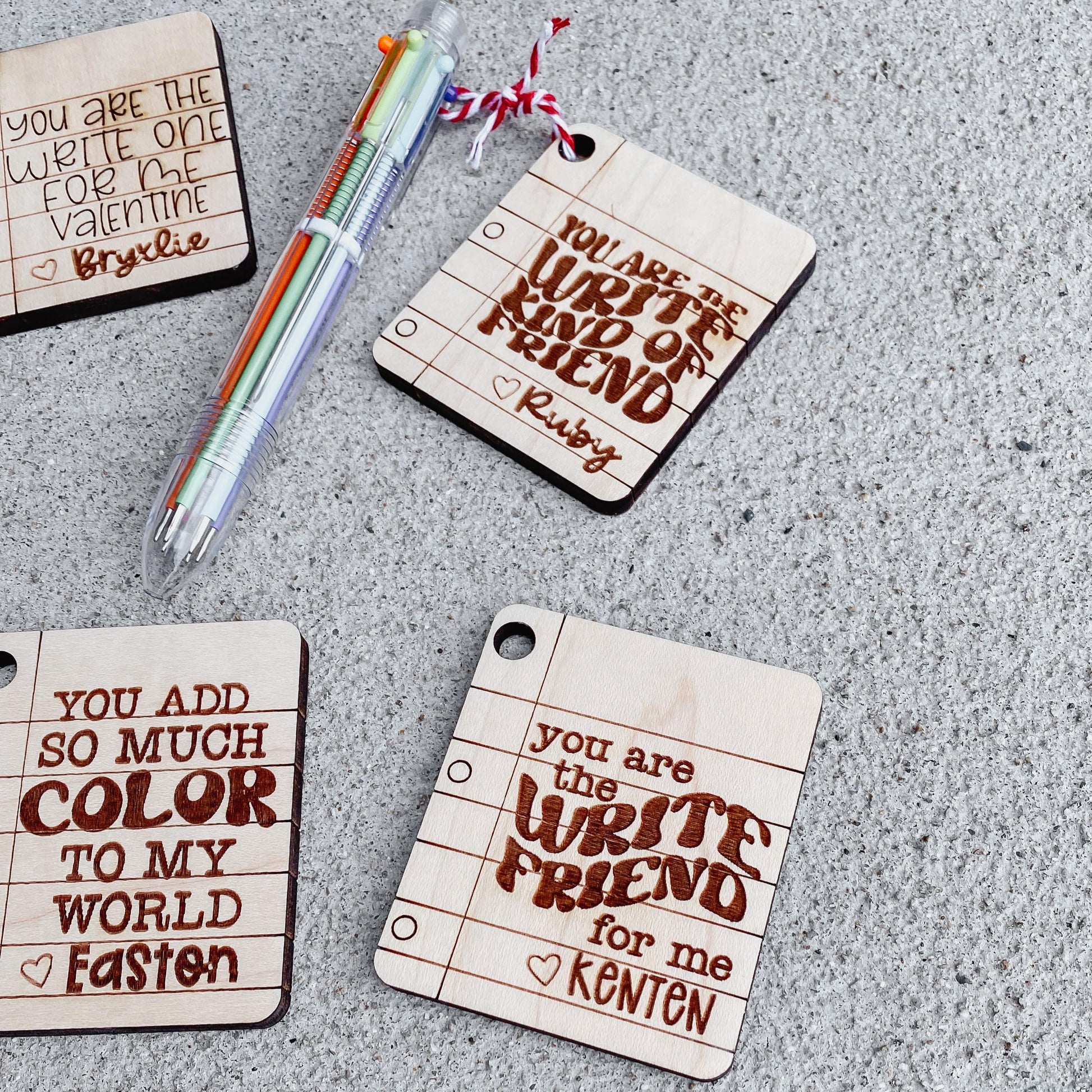 Close-up of multicolor click pen Valentine card with attached pen