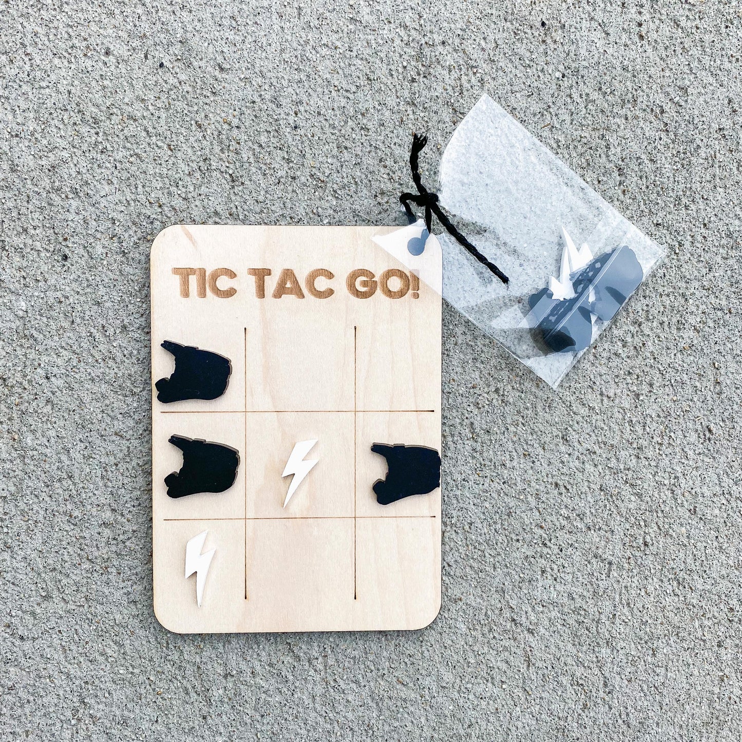 Dirt bike tic tac toe game with lightning bolt and helmet pieces, Easter basket stuffer