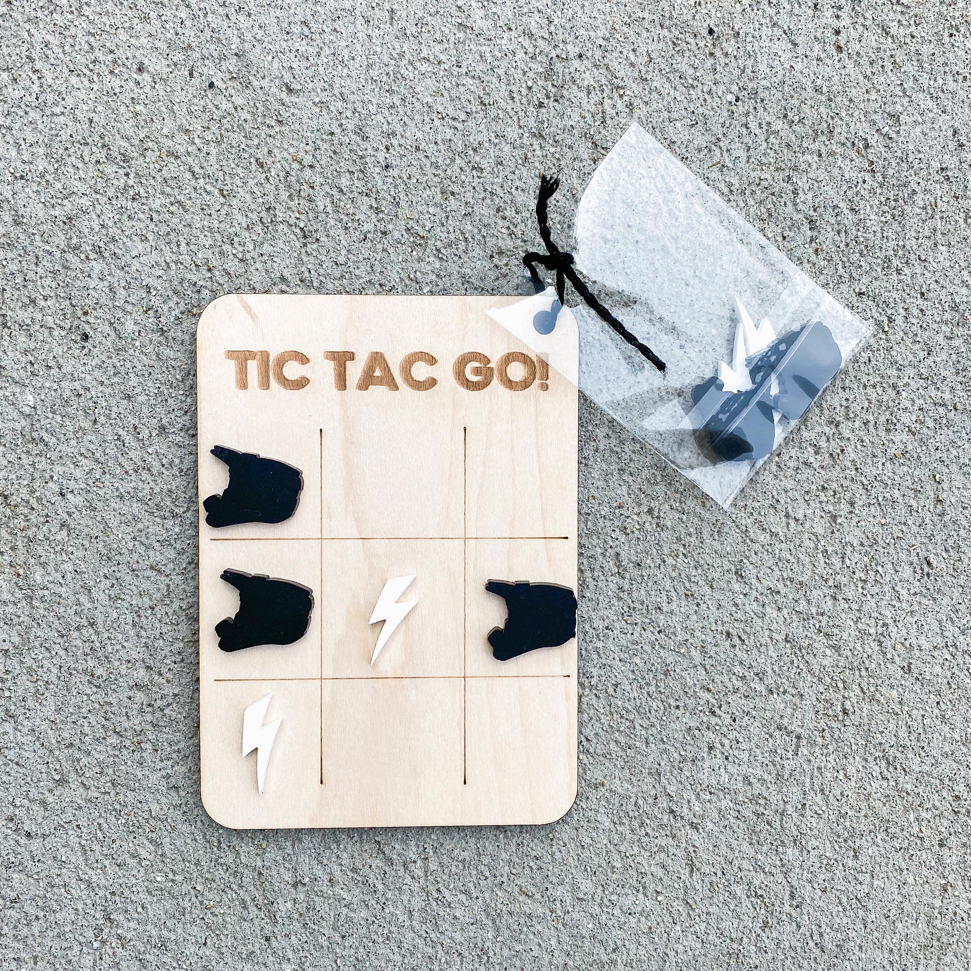 Dirt bike tic tac toe game with lightning bolt and helmet pieces, Easter basket stuffer