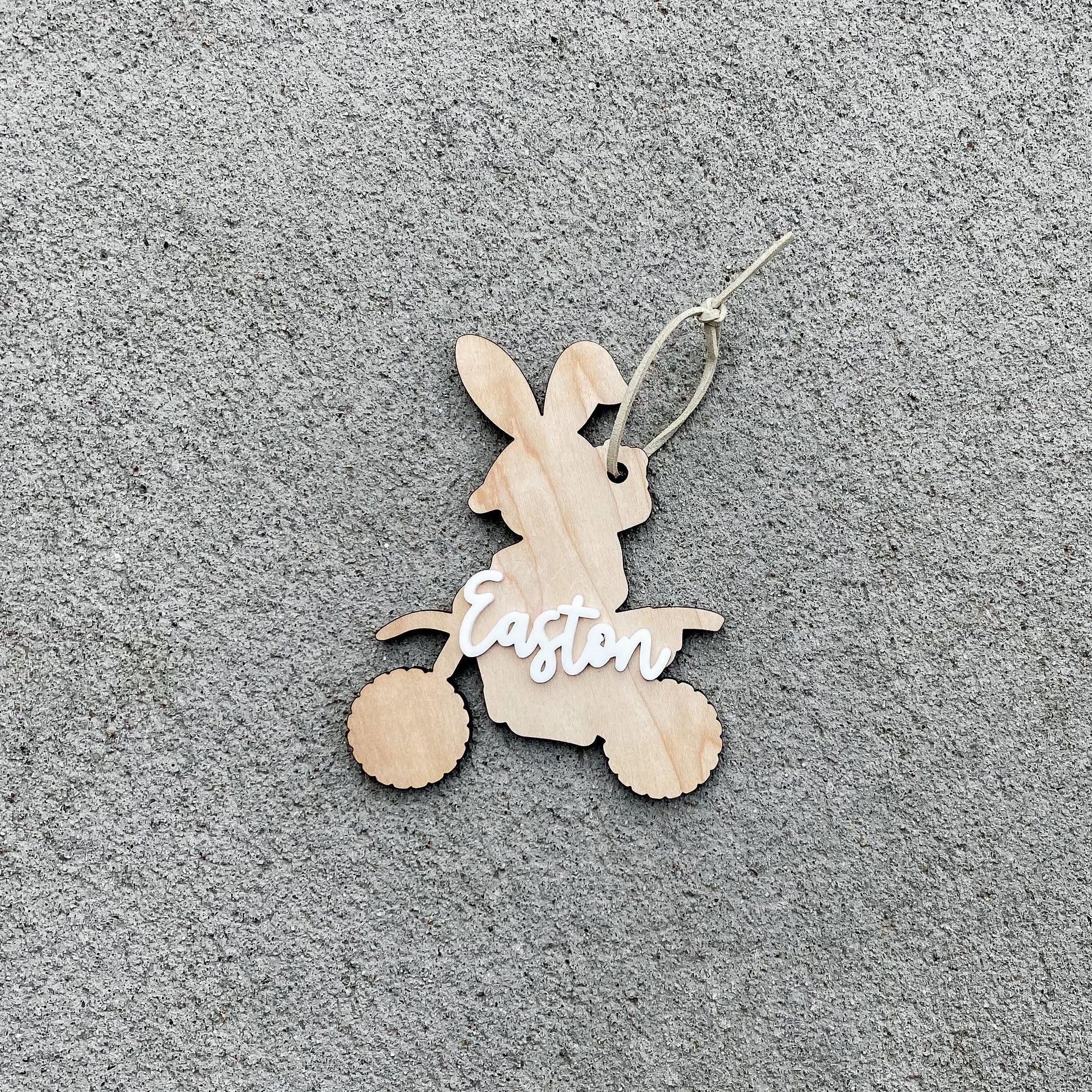 Close-up of dirt bike bunny Easter basket tag with personalized name