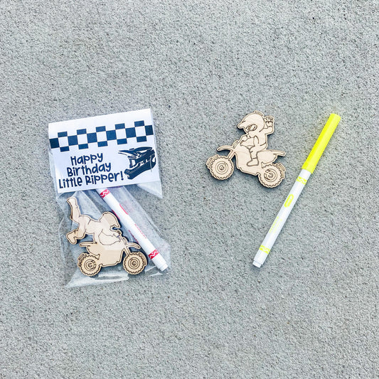 Color your own wooden dirt bike birthday party favor with marker and bag