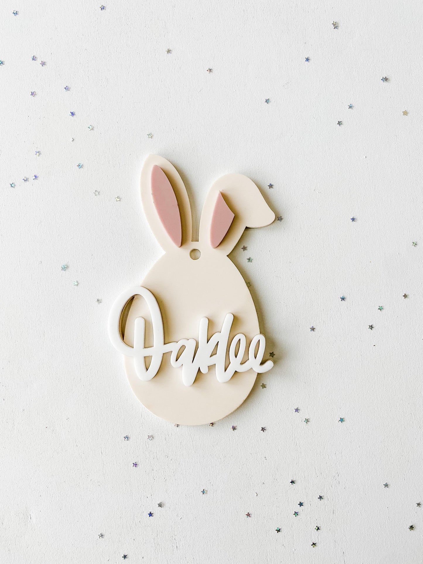 Close-up of Easter bunny basket tag with personalized engraved name