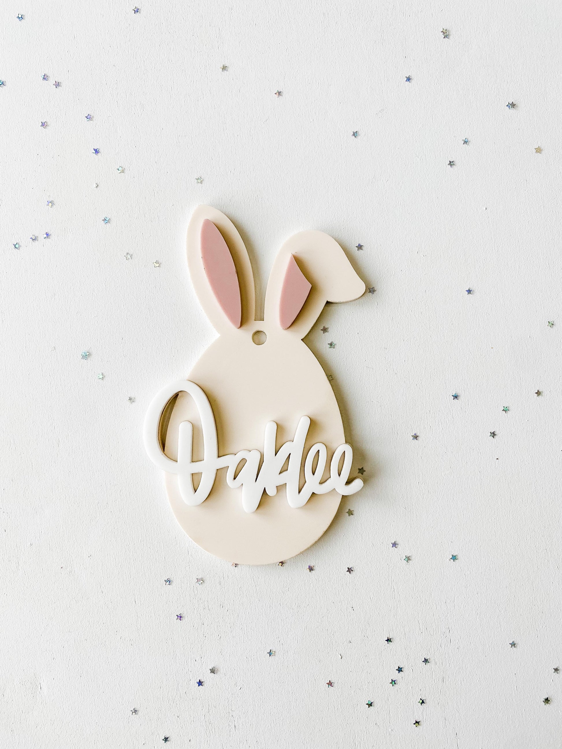 Close-up of Easter bunny basket tag with personalized engraved name